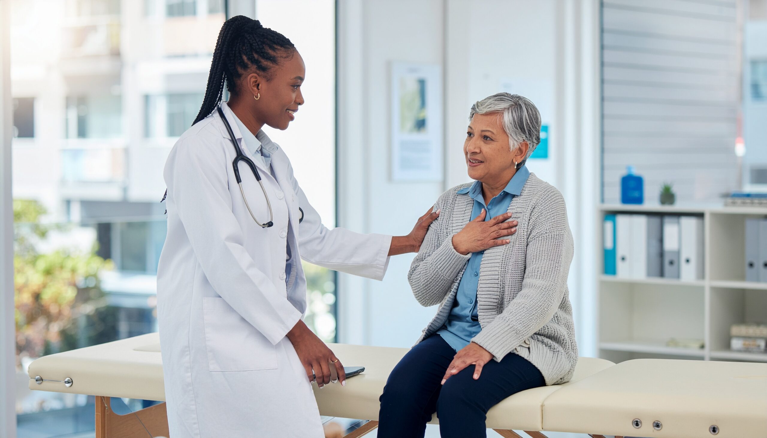 Doctor examining senior patient