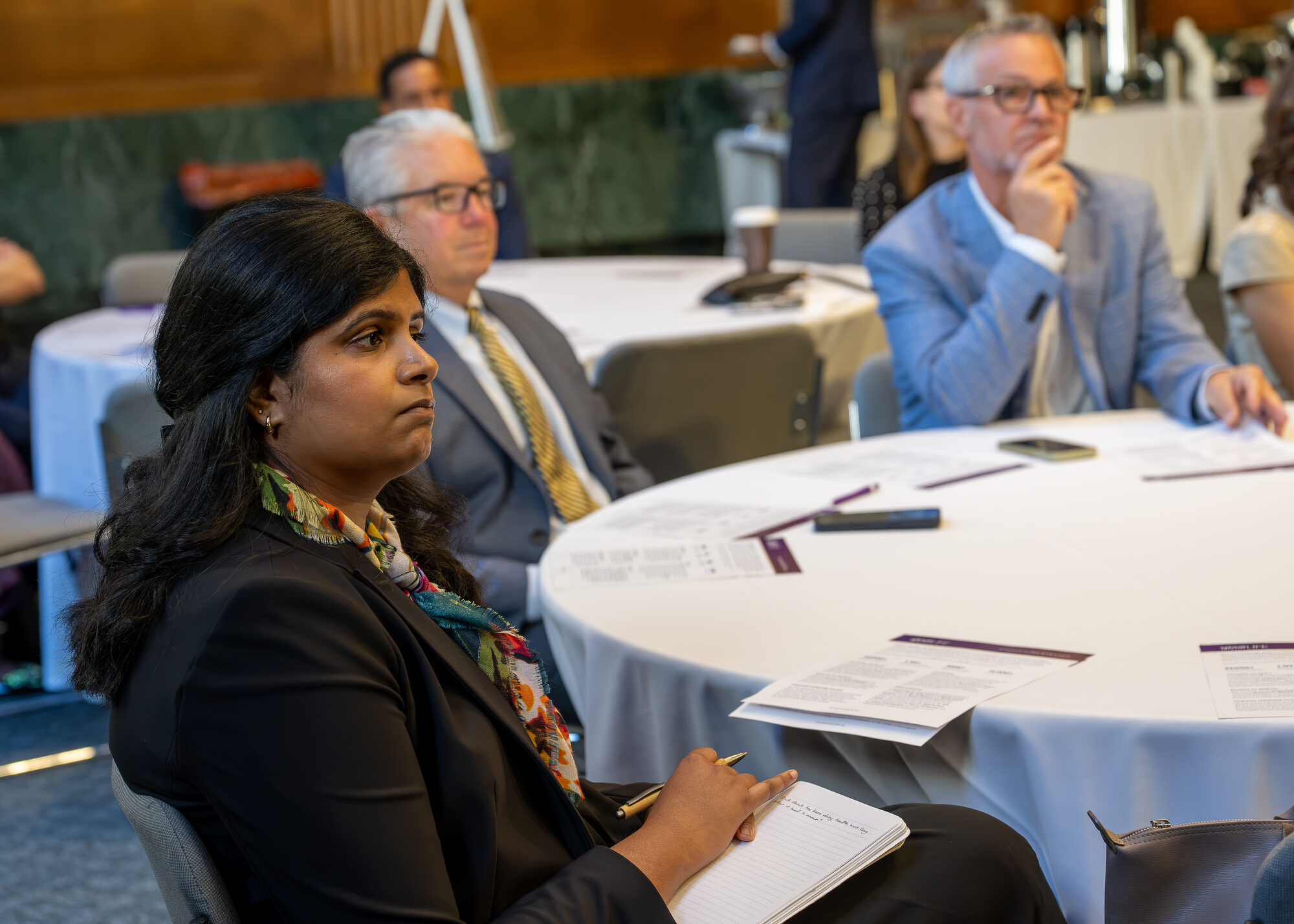 Congressional staffers listen to remarks
