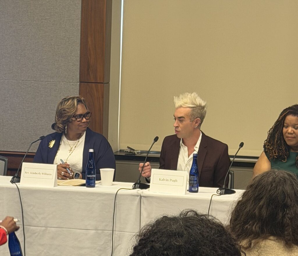 Rev. Kimberly L. Williams and Kalvin Pugh seated at the panel table