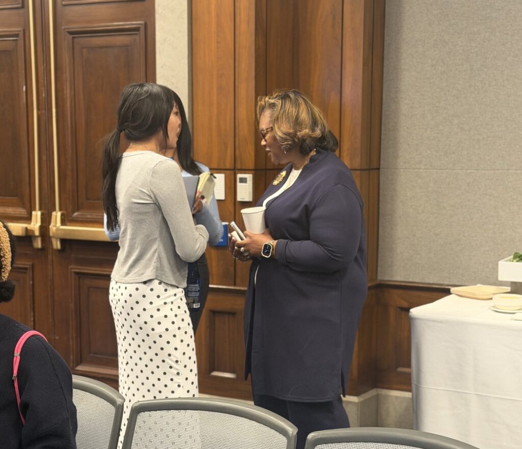 Rev. Kimberly L. Williams talks with an attendee after the panel